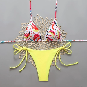 Flat lay of banana print bikini top with bright neon yellow tie-side bikini bottom