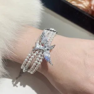 Bracelet multicouche en perles vintage français avec breloque oiseau en zircone