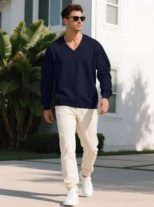 Detailed texture of navy blue V-neck cable knit sweater for men in outdoor setting