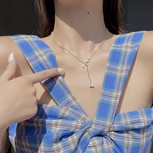 Close-up of S925 sterling silver heart necklace with OT toggle clasp on female neck