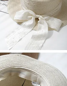 Detail of woven straw hat with silk bow, silver rhinestones and interior sweatband