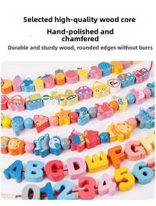 Detail of hand-polished wooden beads with colorful letters, numbers and animal motifs