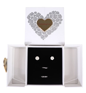Detail view of Everlasting Love white jewelry gift box with rings and flower earrings
