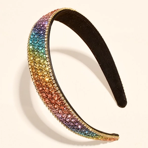 Macro detail of headband featuring rainbow gradient rhinestones on black base