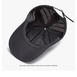 Detail of breathable mesh back and adjustable metal buckle on dark gray baseball cap
