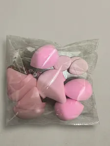 Macro shot of 12-piece pink makeup sponge set in teardrop and cut shapes