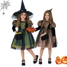 Detail of girls' witch costumes with sequined star tulle layers for Halloween
