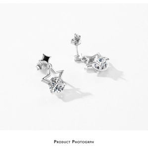 Macro view of S925 sterling silver star earrings with crystal center and black accent