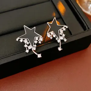 Star-shaped silver earrings with black inlay and sparkling zircon meteor tassels