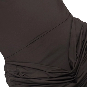 Detail view of ruched fabric on dark brown long-sleeved dress with elegant pleated texture