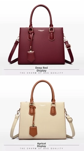 Detail view of dark red and apricot leather handbags with reinforced handles and straps