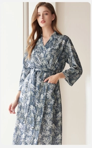 Detail of tropical palm leaf print robe with long sleeves and functional side pockets
