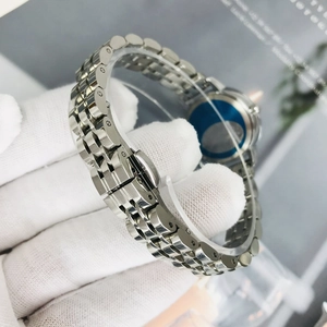 Women's waterproof watch with stainless steel strap and polished silver link chain