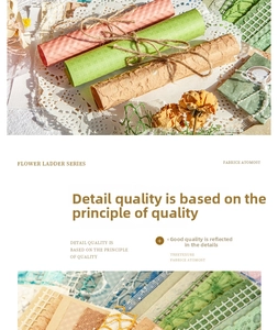 Detailed view of vintage texture paper rolls and dried flowers for DIY scrapbooking kits