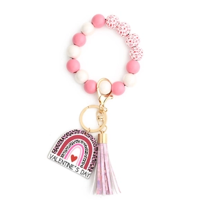 Detail of pink and white silicone bead keychain with VALENTINE'S DAY heart tag and tassel