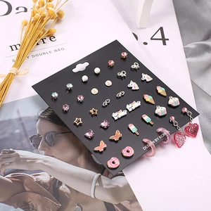 Kid's colorful stud earrings set featuring donuts and unicorns on display card