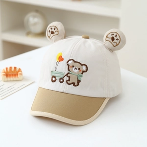 Close-up of baby baseball cap featuring 3D bear ears and cute embroidery detail