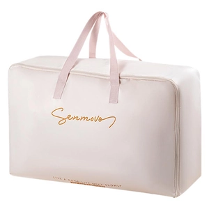 Pink satin storage bag for clothes and quilts with sturdy handles on white background