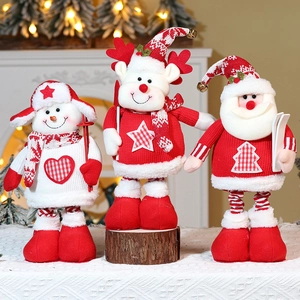 Detail of Christmas plush figurines set with knit textures and festive accessories