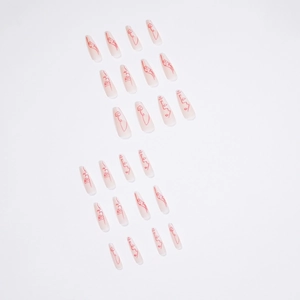 Artistic abstract face outline press-on nails with long coffin shape in nude pink