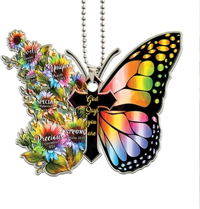 Detail of acrylic butterfly ornament with religious cross and inspirational Bible verses