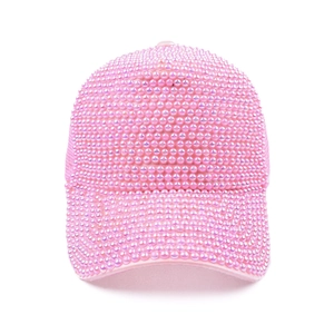 Close-up of pink baseball cap featuring luxury all-over pearls and rhinestone embellishments