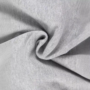 Close-up of soft grey cotton knit fabric texture on a newborn swaddle sleeping bag