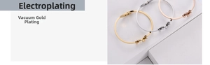 Macro shot of three-tone gold plated butterfly bangles with smooth metallic finish