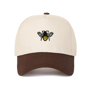 Classic color-block trucker hat with bee embroidery and cream canvas six-panel design