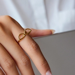Minimalist 18K gold stainless steel ring with infinity sunglasses design on hand