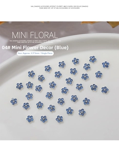 Detailed macro view of 3.5mm blue metal flower nail art charms with crystal center