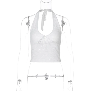 Close-up of white lace halter top featuring floral patterns and drawstring bow detail