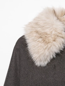 Close-up of faux fur collar and dark brown wool fabric texture on a winter jacket