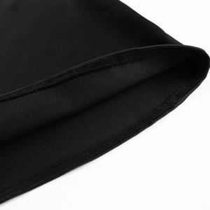 Close-up of double-stitched hem and knit fabric texture on this black A-line dress