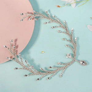 Detailed close-up of a silver bridal hair vine with marquise and teardrop rhinestones