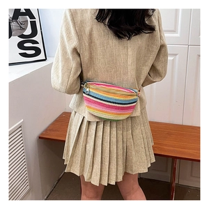 Colorful Bohemian woven fanny pack with multi-color stripes and gold zipper detail