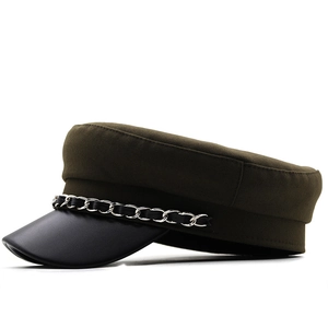 Detail view of cotton baker boy hat featuring olive fabric and silver chain trim