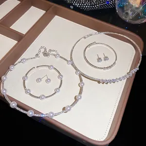 Elegant 5-piece jewelry set with pearl necklace, bracelet and zircon studs in silver