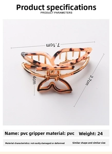 Detail view of butterfly hair claw clip with dimensions 7.1cm x 4cm and weight 24g