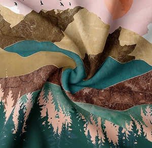 Close-up of landscape print fabric showing detailed texture of mountains and forest