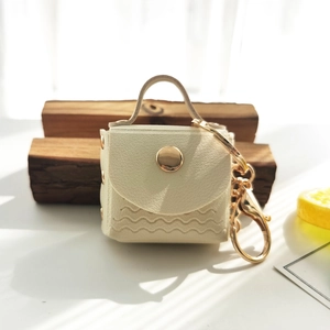Mini PU leather keychain purse with cream wavy quilting and gold snap button closure