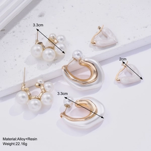 Detailed view of fashion earring set with alloy resin pearls and C-shaped geometric designs