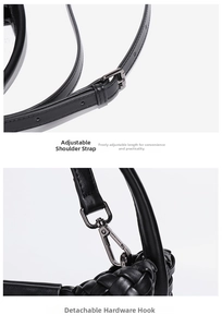 Detail of adjustable shoulder strap and gunmetal hardware on black woven bucket bag