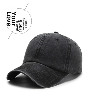 Macro view of washed vintage dark grey cotton baseball cap with reinforced stitching