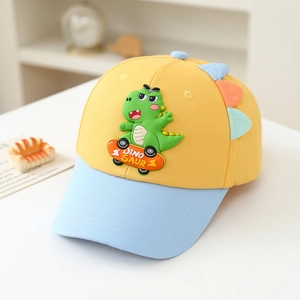 Detail of yellow kids baseball cap with 3D skateboard dinosaur patch and blue brim