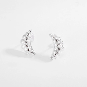 Detailed view of S925 sterling silver croissant earrings with textured metallic finish