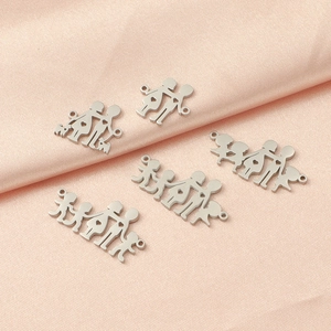Family themed stainless steel charms featuring boy girl and pet silhouettes on pink fabric