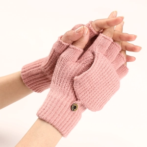 Detailed close-up of pink knitted fingerless gloves with striped texture and flap button
