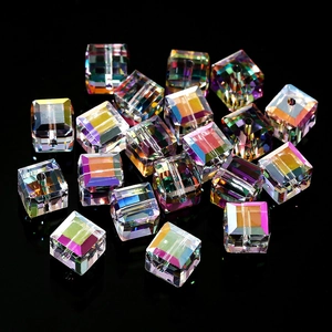 Macro view of Aurora AB cube crystal glass beads with central drill holes for DIY jewelry