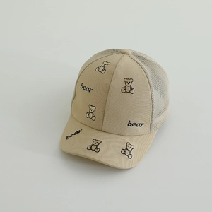 Detailed close-up of beige bear embroidery and mesh texture on the children's sun hat